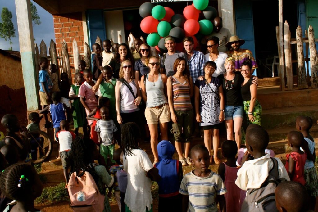 Community members and visiting partners gathered outdoors at Dago.