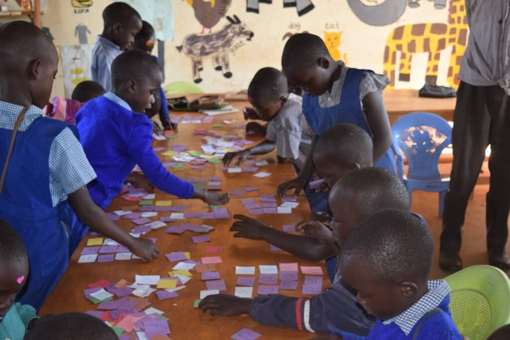 Young people collaborating around a table during a hands-on learning activity.